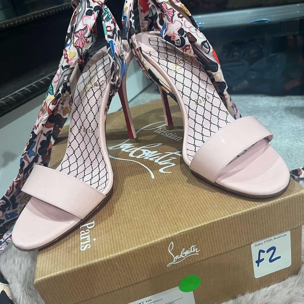 Pink Louboutins with tie up straps. Size 38